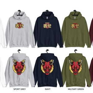 May include: Ten different color variations of a hooded sweatshirt with a Japanese character and a demon mask graphic. The colors are white, sport grey, navy, military green, and maroon.