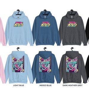 May include: A set of ten hoodies in various colours, including pink, light blue, indigo blue, dark heather grey, and black. The front of each hoodie features the Japanese word "otaku" in a colourful, retro-style graphic. The back of each hoodie features a colourful graphic of a person with a manga-style design.