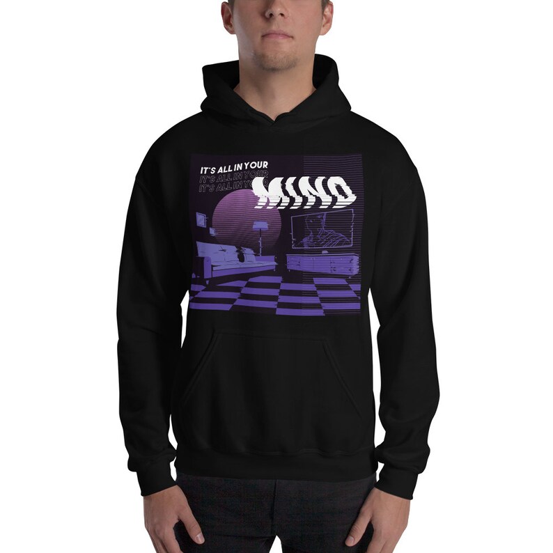May include: Black hooded sweatshirt with a graphic print of a living room interior with a television, couch, and lamp. The text "IT'S ALL IN YOUR MIND" is repeated in a distorted font.