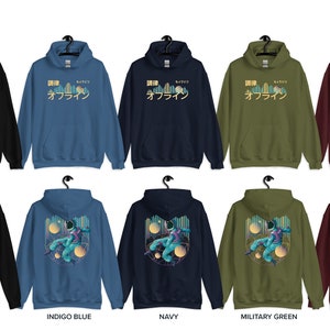 May include: A set of ten hooded sweatshirts in various colours, including black, indigo blue, navy, military green, and maroon. Each sweatshirt features a graphic print of a cityscape with the Japanese text "調律。オフライン" on the front.