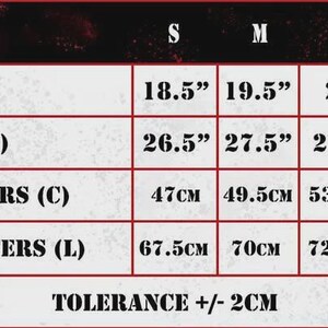 May include: A size chart with measurements for chest and length in inches and centimeters. Sizes range from S to 2XL, with chest measurements from 18.5" to 23" and lengths from 26.5" to 30.5". Chest measurements in centimeters range from 47cm to 58.5cm.