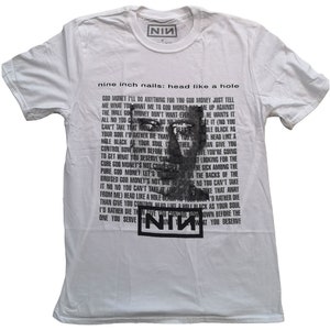 May include: White t-shirt featuring the text "nine inch nails: head like a hole" and a graphic of a face. The shirt also has lyrics printed on it and the band's logo, "NIN", in a black rectangle.