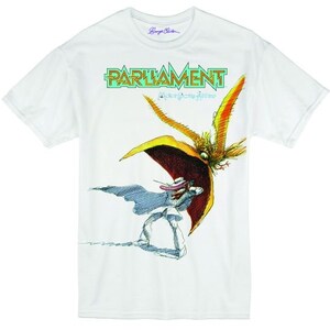 May include: White t-shirt with a graphic print of a cartoon character wearing a hat and cape. The character is standing in front of a large bird with a red beak. The text "PARLIAMENT" is printed in yellow above the graphic. The text "Mothership Connection" is printed in green below the graphic.