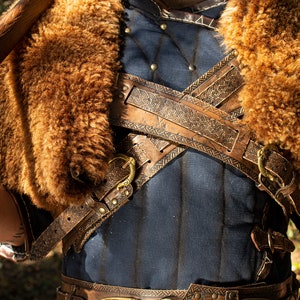 Viking cloak for a viking armor to larp. Cross leather straps style celtic. Handmade with natural sheepskin.