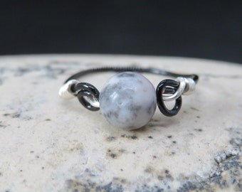 Modern and unique handmade black and silver wire wrap ring with genuine grey Zebra Agate solitaire gemstone UK size K