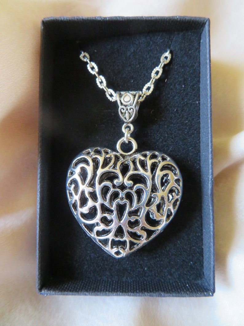 large silver patterned heart necklace.. unusual and gorgeous gift! Eye-catching