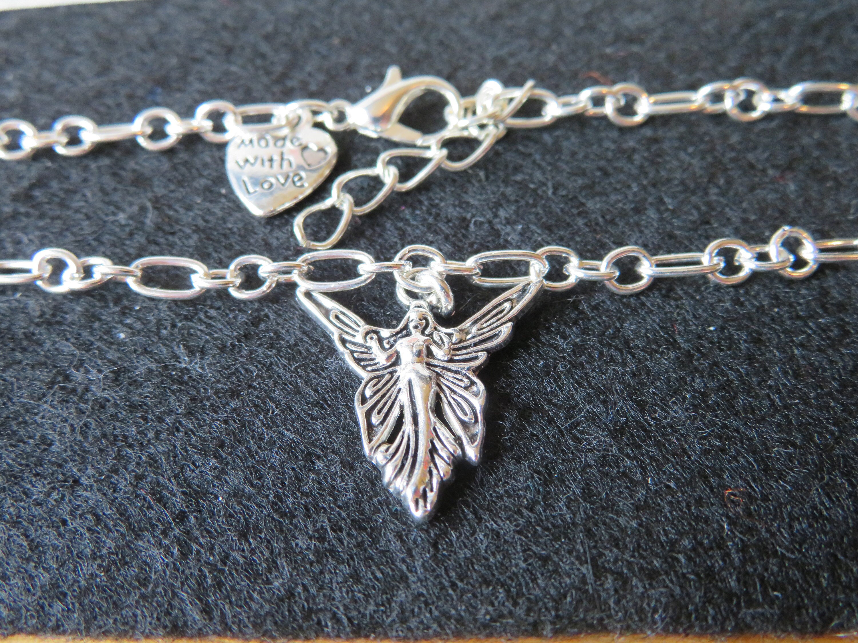 Stunningly detailed silver Angel charm bracelet on a Etsy