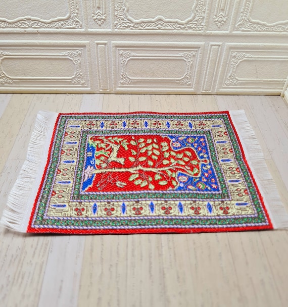 1:24 scale handwoven rug. Blue, red and green tree pattern.