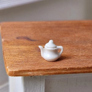 1:24 scale ceramic white tea pot with removable lid.