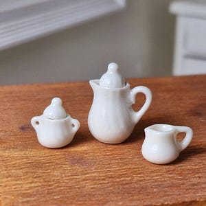 1:24 scale porcelain white 3pc coffee set. Coffee pot, sugar bowl and milk jug.