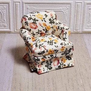 1:24 scale beige floral dollhouse arm chair.