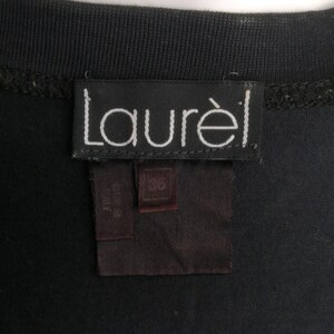 May include: Black tag with white text that reads "Laur&egrave;l" and a smaller black tag with white text that reads "L/G"