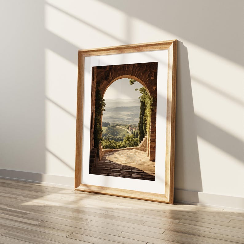 Tuscan arch print: brick Italian archway framing a countryside valley with stone path and olive trees in oil painting style.