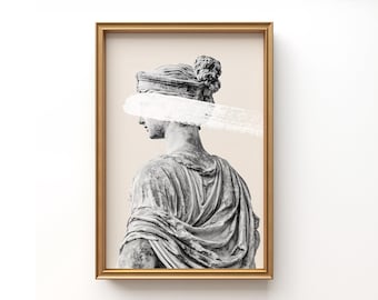 May include: A black and white photograph of a plaster statue of a woman with a white paint stroke across her eyes. The statue is wearing a draped robe and has her hair pulled back in a bun. The background is a light beige color.