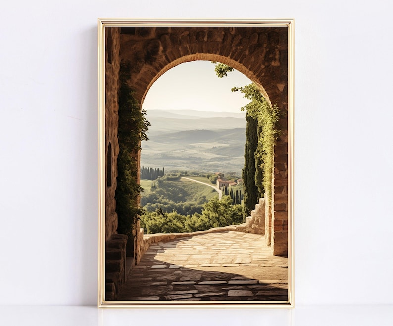 Tuscan arch print: brick Italian archway framing a countryside valley with stone path and olive trees in oil painting style.