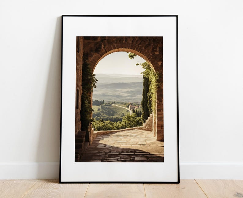 Tuscan arch print: brick Italian archway framing a countryside valley with stone path and olive trees in oil painting style.