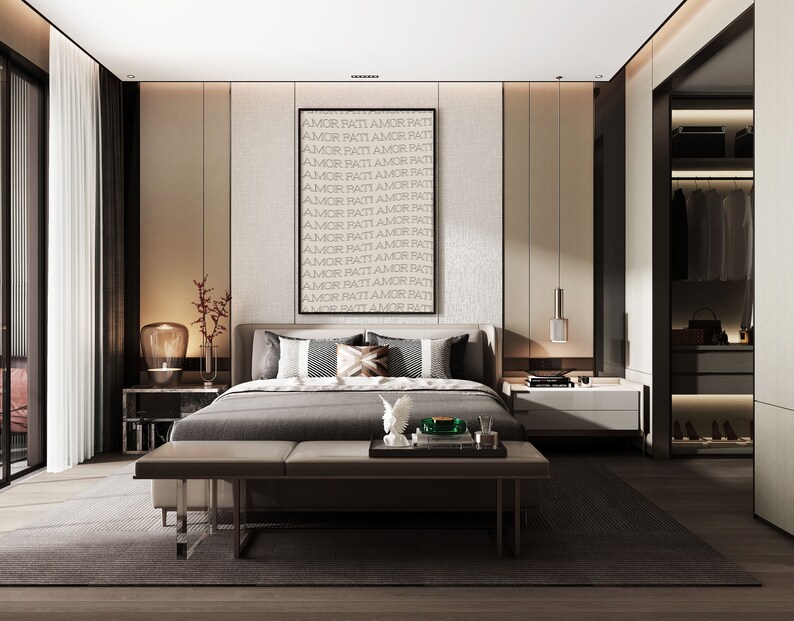May include: A modern bedroom with a gray bed, a white nightstand, and a large closet. The bedroom has a gray rug and a large window with white curtains. The wall behind the bed has a black frame with the text "AMOR PATI AMOR PATI" repeated many times.