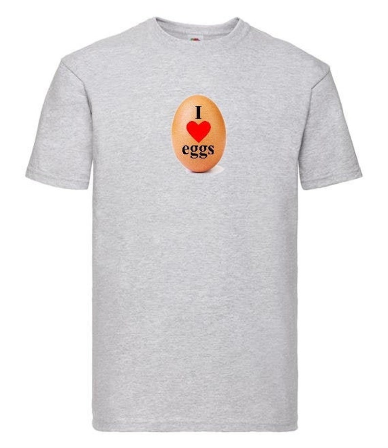 May include: A gray t-shirt with a brown egg graphic and the text "I love eggs" printed on the front.