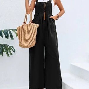 Long sleeveless overalls jumpsuit in Boho style, loose and casual, with pockets, women's clothing. Black