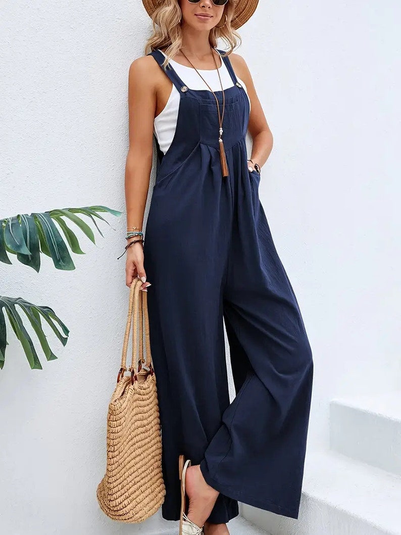 Long sleeveless overalls jumpsuit in Boho style, loose and casual, with pockets, women's clothing. Blue