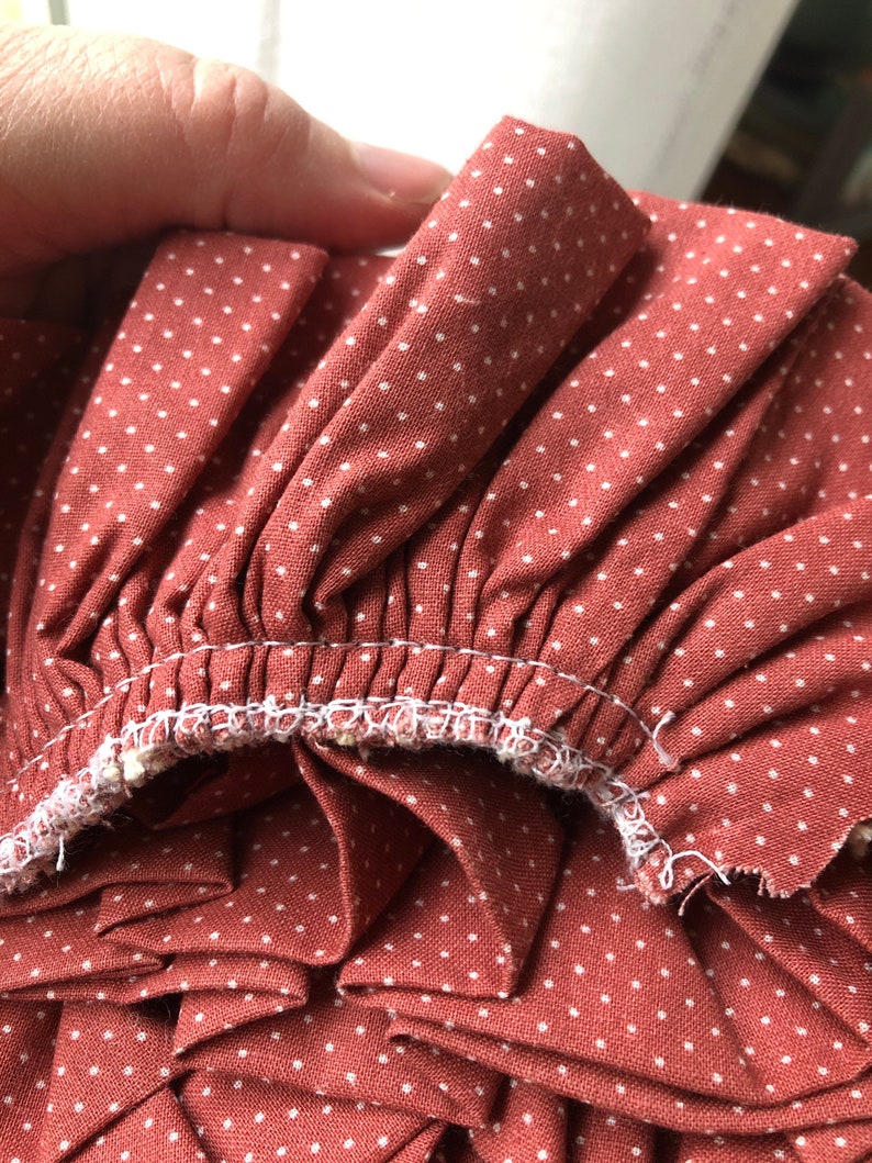 Rose polka dot ruffled trim with ecru crocheted lace