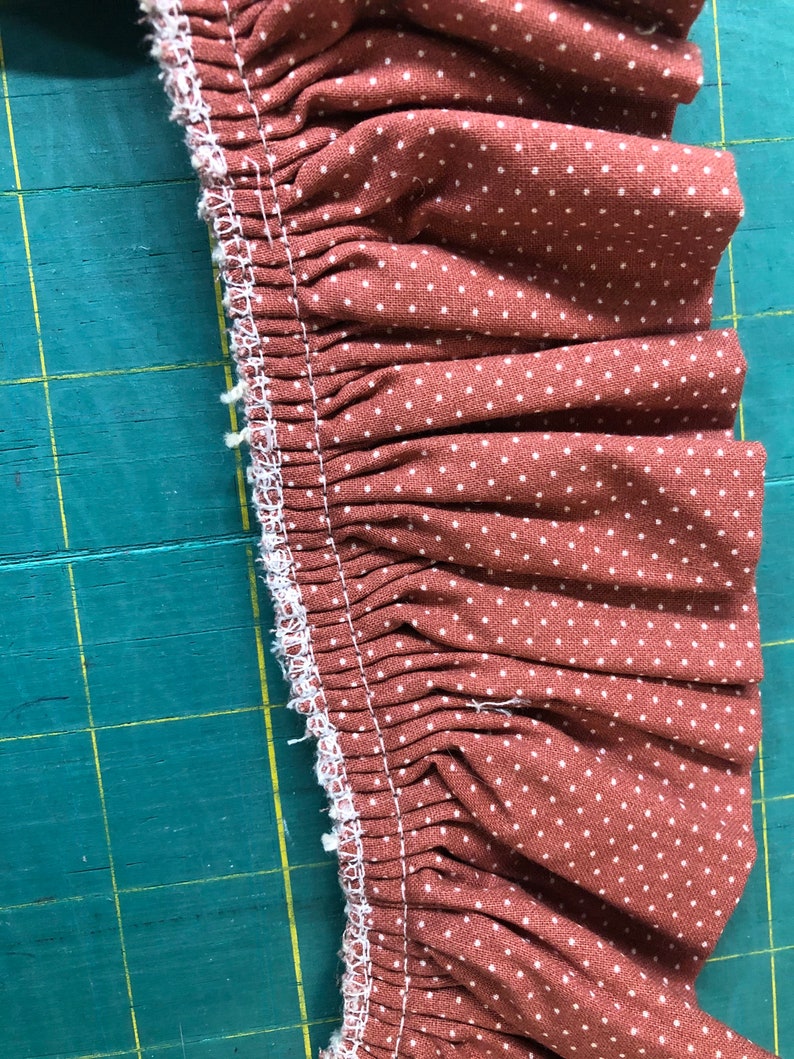 Rose polka dot ruffled trim with ecru crocheted lace