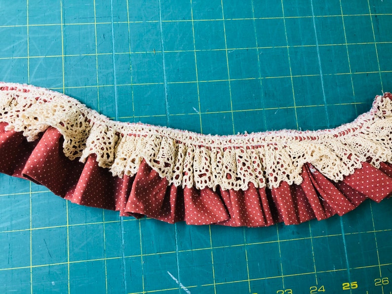 Rose polka dot ruffled trim with ecru crocheted lace