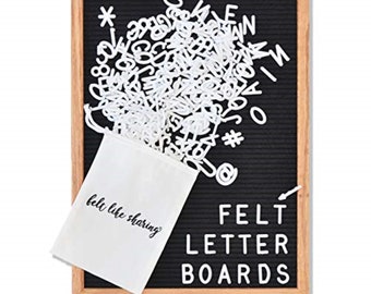 May include: A black felt letter board with a wooden frame. The board is filled with white felt letters and numbers. The letters are in a white drawstring bag with the text "felt like sharing" printed on it. The board has the text "FELT LETTER BOARDS" printed on it in white felt letters.