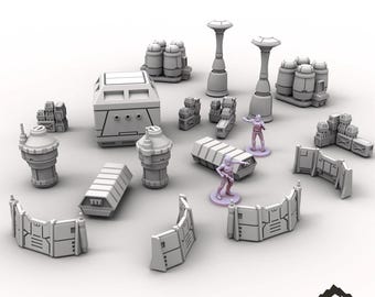 May include: A collection of gray 3D-printed tabletop terrain pieces, including walls, containers, and cylindrical structures. The set also features two miniature figures. The words "SCATTER SET" are at the top of the image.