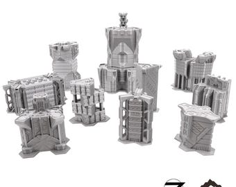 May include: A collection of gray miniature buildings, including towers and structures, arranged on a white background. The text "TRINITY CITY CORE SET" is at the top. The Tabletop Terrain logo is in the bottom right corner.