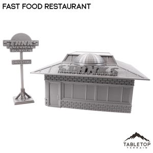 Könnte beinhalten: Ein graues 3D-gedrucktes Modell eines Fast-Food-Restaurants mit Drive-In. Das Restaurant hat ein Schild mit der Aufschrift "Stanks American Burger" und ein kuppelförmiges Dach.