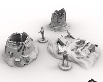 May include: A set of three gray, 3D printed, sci-fi themed terrain pieces for tabletop gaming. The pieces depict a destroyed rebel base with a large, cylindrical structure, a smaller, cylindrical structure, and a pile of debris. The pieces are designed to be used in tabletop wargames and role-playing games.