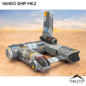 Könnte beinhalten: Ein graues und weißes Raumschiffmodell mit gelben Akzenten. Das Modell heißt "Vando Ship MK2" und wird von Tabletop Terrain hergestellt.