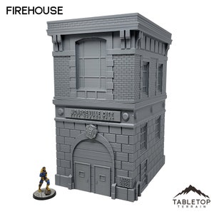 Puede incluir: Un edificio de estación de bomberos gris de tres pisos con un letrero que dice "Monroeville City Fire Department". El edificio tiene una gran puerta de garaje con las palabras "Ladder 2822" impresas debajo.