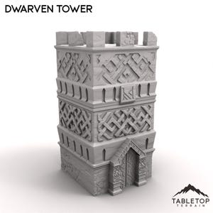 May include: A gray Dwarven Tower model with intricate carved details and a textured surface. The tower features a rectangular design with a detailed arched doorway and a crenelated top. The text "DWARVEN TOWER" is at the top.