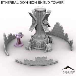 May include: A gray Ethereal Dominion Shield Tower with a central structure and four angled panels. The image includes a miniature figure and segmented walls. The text "ETHEREAL DOMINION SHIELD TOWER" is at the top. The Tabletop Terrain logo is at the bottom.