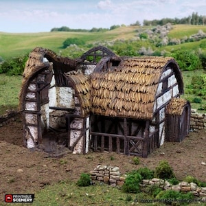 May include: A detailed miniature model of a dilapidated medieval building with a thatched roof. The structure has exposed wooden beams, stone walls, and a partially collapsed roof, set against a backdrop of green hills.
