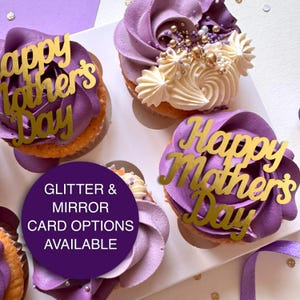 May include: Purple and white cupcakes with gold glitter and gold lettering that says "Happy Father's Day" and "Happy Mother's Day".