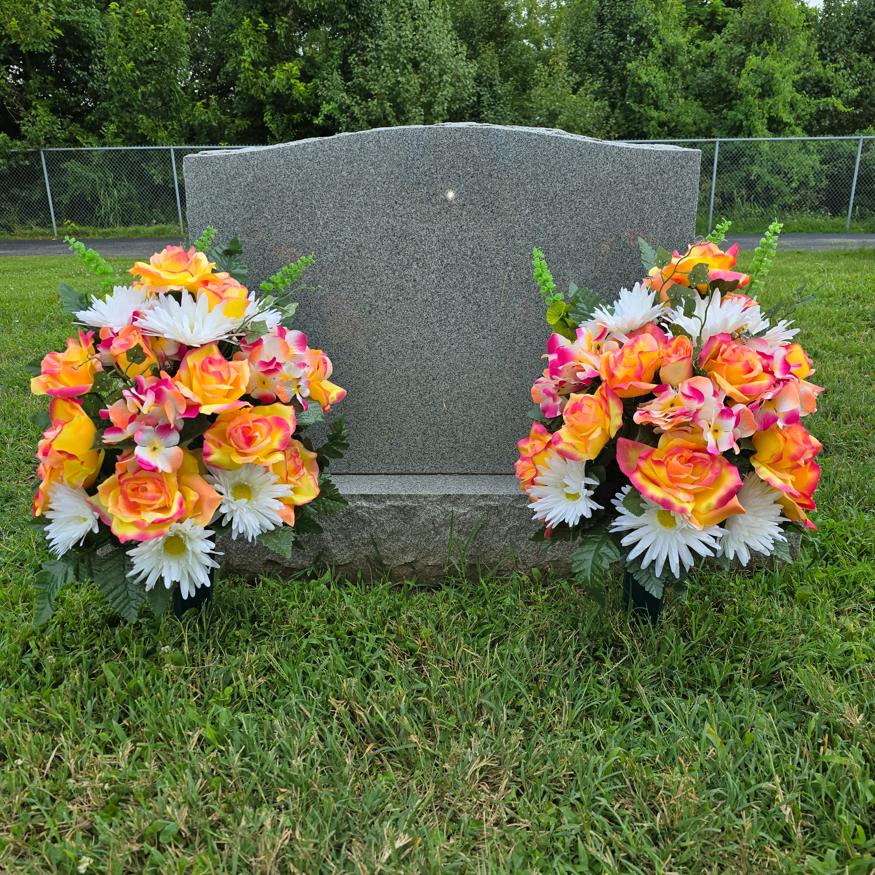 This cemetery cone pair has peach rose, white gerbera daisies, hydrangea, & bells of Ireland. These grave flowers are a memorial decoration.