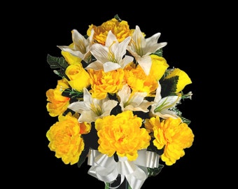 This cemetery cone has grave flowers including yellow Peony, lily, and rosebuds. It is a perfect summer memorial decoration.