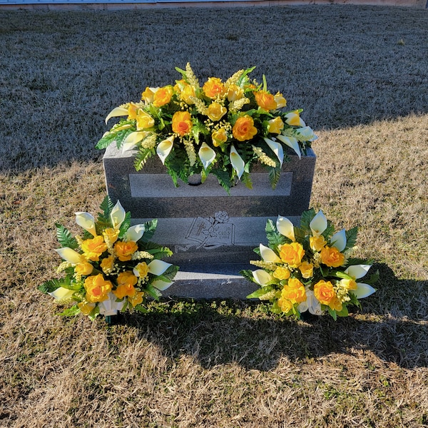 This headstone saddle and cemetery cone set has silk grave flowers including yellow Calla Lilies and Roses.