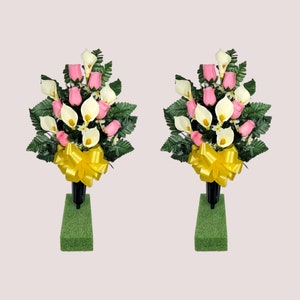 This cemetery cone pair has grave flowers including Pink Rosebuds and Calla Lilies. It is 2 funeral or memorial decorations.