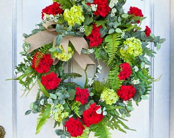 This Front Door Wreath has Red Geraniums, Green Hydrangeas, Fern, and more! Perfect Elegant Home Decor Spring & Summer Wreath Door Decor.