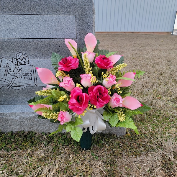 This cemetery cone has grave flowers including Beauty Pink Calla Lily and Roses. It is a perfect funeral or memorial decoration.