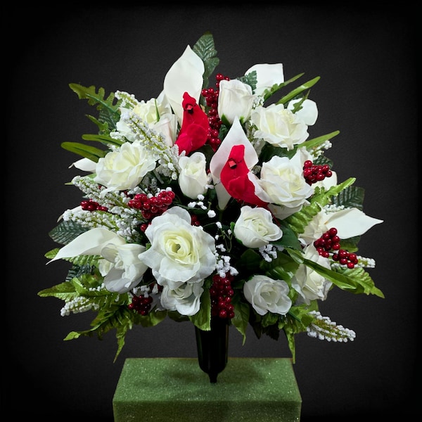 This Jumbo cemetery cone has grave flowers including Cream Calla Lilies, Roses, Berries, & a cardinal. It is a perfect memorial decoration.