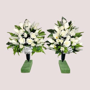 This jumbo cemetery cone pair has grave flowers including Cream Calla Lily & Rose. It is a perfect funeral or cemetery memorial decoration.