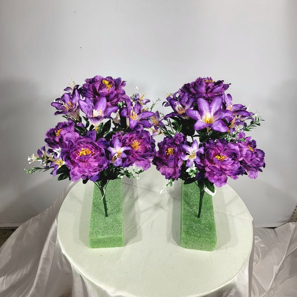 This is a pair of Purple, Lavender,  Peony/lily bushes with 12 stems of blooms and fillers. Great Craft item for Spring or Memorial decor.