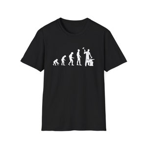 May include: Black t-shirt with a white silhouette of the evolution of man, ending with a blacksmith holding a hammer and standing next to an anvil.