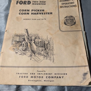 May include: A vintage Ford Corn Picker Corn Harvester manual. The cover features the Ford logo, the text "Assembly and Operating Instructions," and an illustration of the harvester. The manual is for models 16-66 and 16-76. Prepared by Tractor and Implement Division, Ford Motor Company, Birmingham, Michigan.