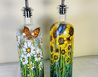 A pair of functional hand painted and fired storage bottles by Andrew Jenkins